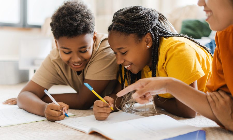 cheerful-woman-and-kids-drawing-at-home-at-the-car-2025-02-20-10-28-51-utc-min