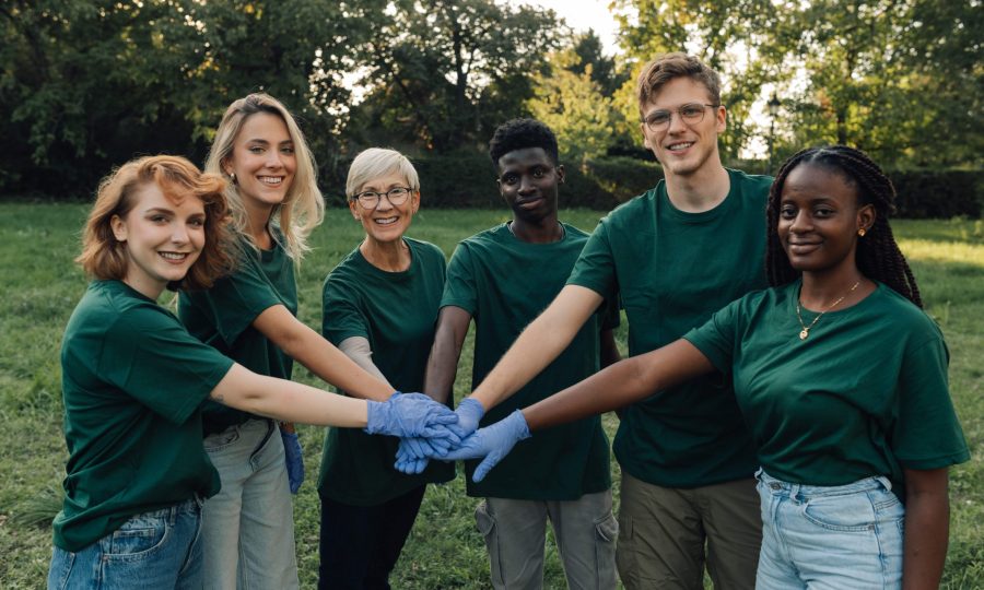 group-of-volunteers-putting-hands-together-wearing-2025-01-28-20-06-31-utc-min