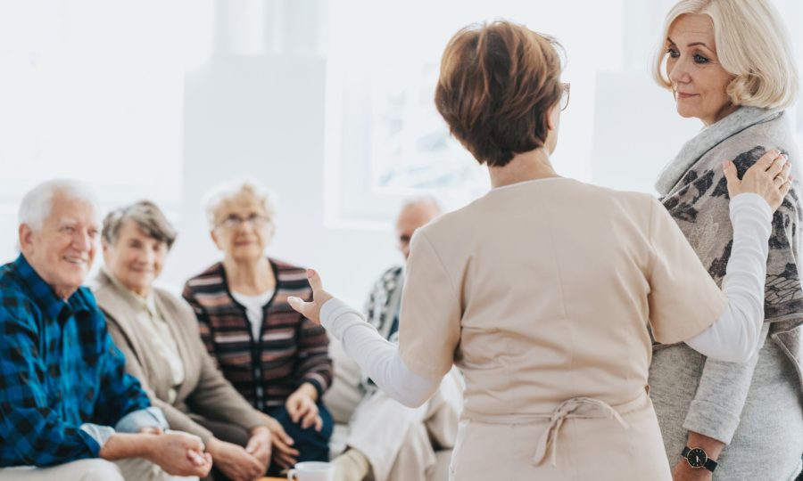 volunteer-helps-seniors-living-in-a-care-home-for-2024-10-22-13-30-18-utc-min